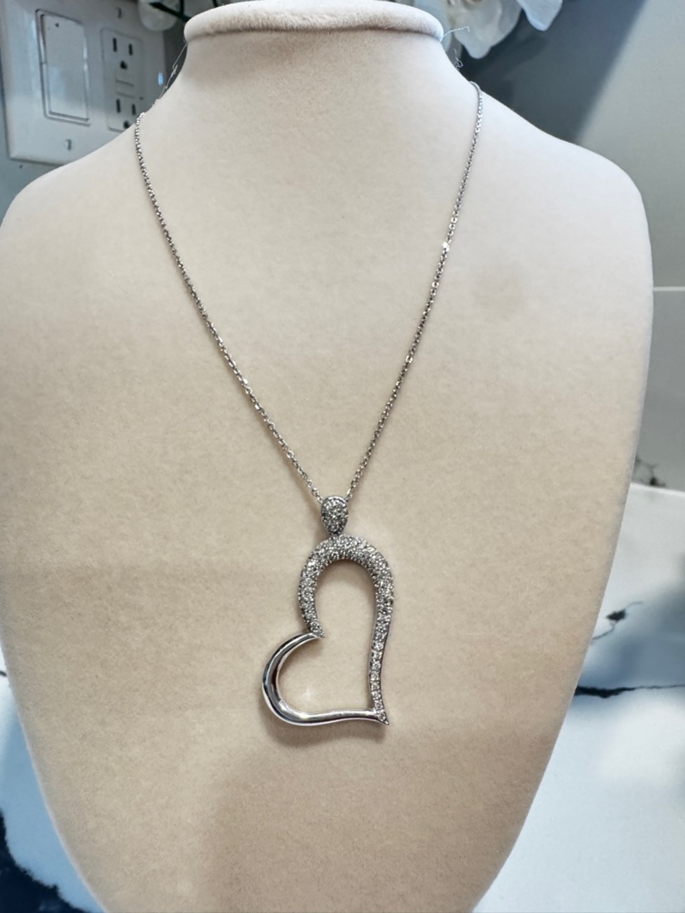 14 K white gold diamond heart necklace pendant with diamonds and chain.